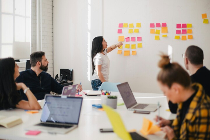 People in workshop in an office room.